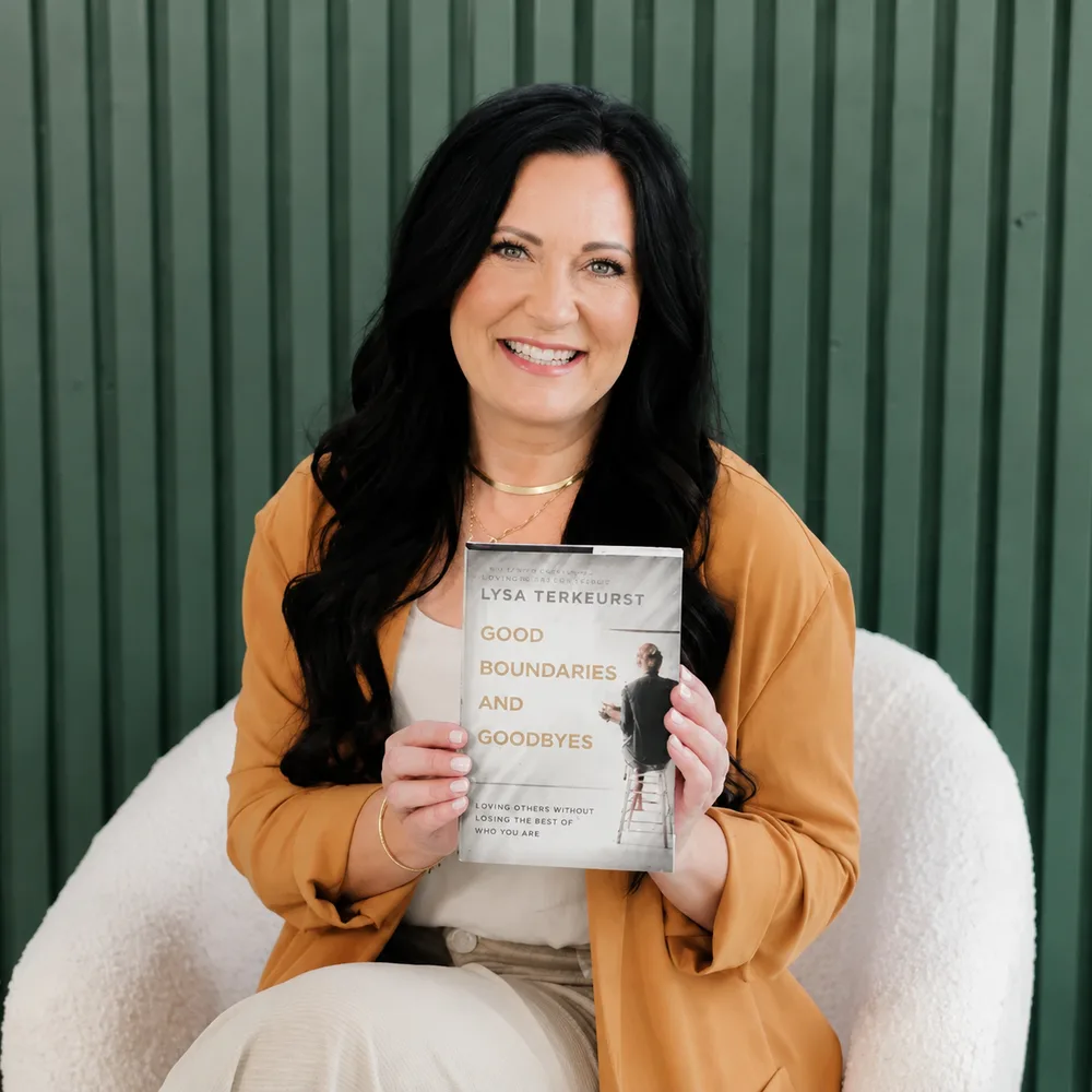 An author holding her published book